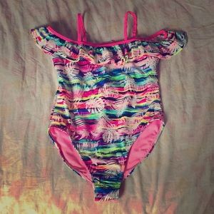A tropical never worn before bathing suit